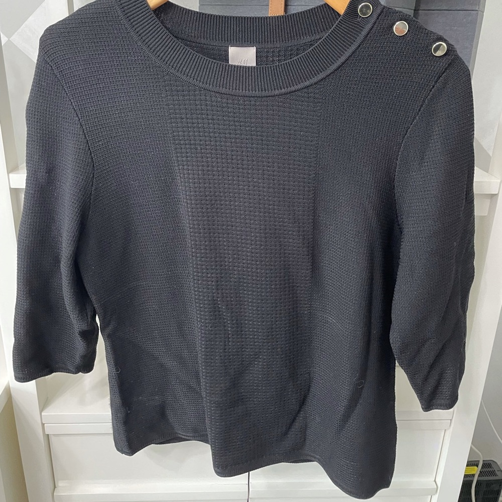 H&M black sweater. Size large.  3 gold buttons